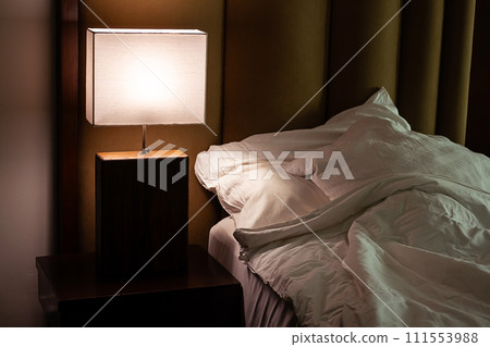 Trendy bedroom interior with luminous lamp with lampshade. Trendy bedroom interior with luminous lamp with lampshade. 111553988