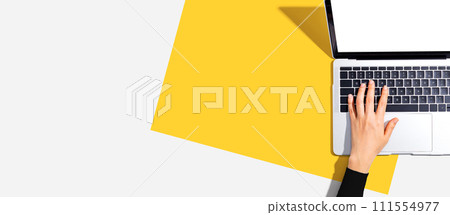 Person using a laptop computer Person using a laptop computer 111554977