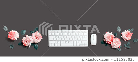 Computer keyboard and a mouse with pink roses 111555023