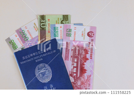 North Korea currency won in cash banknotes in North Korea of passport on white background 111558225