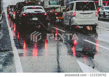 Traffic jam on the main road on a snowy evening, film style 111558742