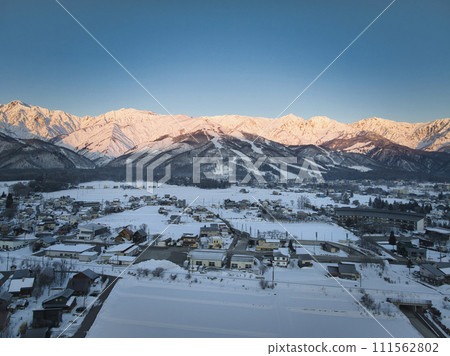 Hakuba Village and Morgenrot of the Hakuba Mountain Range, Hakuba Village, Nagano Prefecture (aerial photography by drone) Hakuba Village and Morgenrot of the Hakuba Mountain Range, Hakuba Village, Nagano Prefecture (aerial photography by drone) 111562802