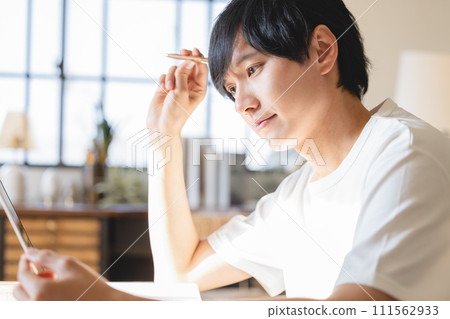 High school boy studying on a tablet High school boy studying on a tablet 111562933