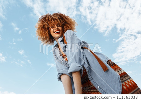 Smiling Woman Dancing on a Sandy Beach, Embracing Freedom and Happiness under the Blue Sky Smiling Woman Dancing on a Sandy Beach, Embracing Freedom and Happiness under the Blue Sky 111563038