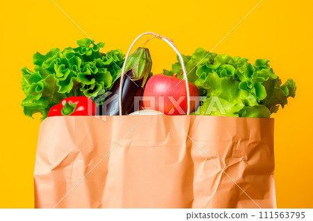 Craft brown shopping paper bag and grocery on blue background. Delivery concept Craft brown shopping paper bag and grocery on blue background. Delivery concept 111563795