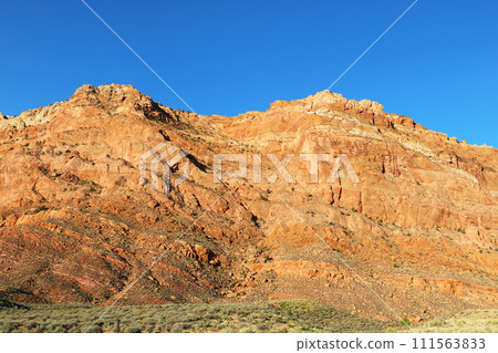 The beautiful light of the sun falls on the mountainside. The beautiful light of the sun falls on the mountainside. 111563833