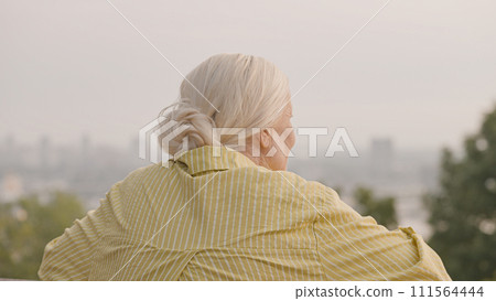 Senior woman admiring beautiful view, enjoying retirement travel, active life 111564444