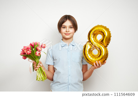 Happy child with Tulips bouquet and balloon number 8 Happy child with Tulips bouquet and balloon number 8 111564609