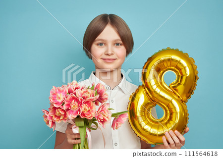 Happy child with Tulips bouquet and balloon number 8 111564618