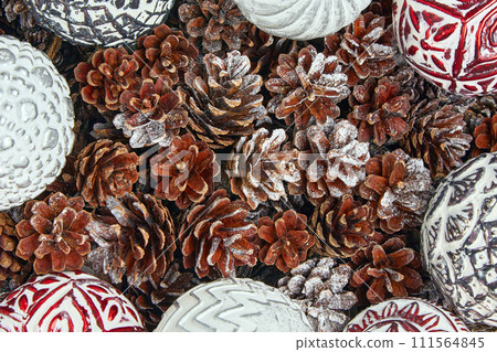 New Year frame made of frosted pine cones and Christmas balls. Christmas decor top view 111564845