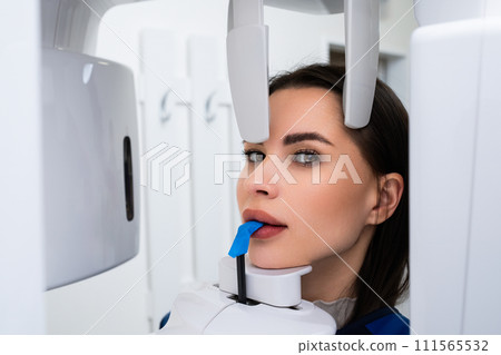 X ray examination of teeth of young woman in dentist office X ray examination of teeth of young woman in dentist office 111565532