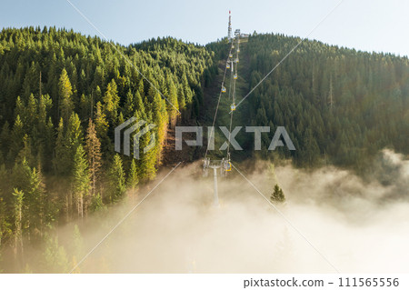 The ski lift takes tourists to the top of Seceda mountain.  111565556
