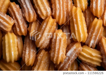 Pattern made with traditional Spanish dessert churros with powdered sugar 111566226