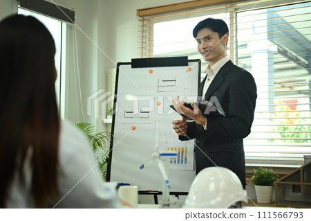 Confident businessman giving a presentation about renewable energy at meeting Confident businessman giving a presentation about renewable energy at meeting 111566793