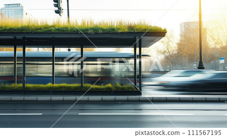 Side view of bus stop with green roof near the roadnd cars passing by in blur with cityscape at the background 111567195