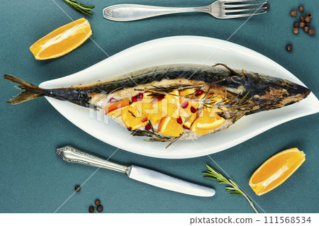 Whole mackerel baked with oranges. Whole mackerel baked with oranges. 111568534