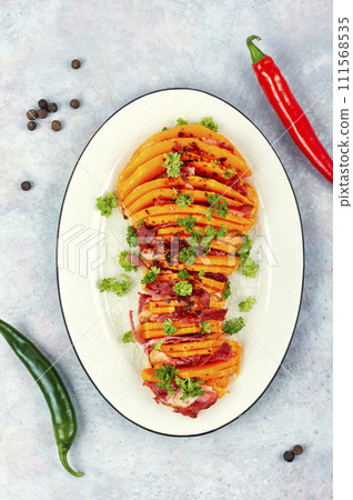 Baked pumpkin with bacon. Baked pumpkin with bacon. 111568535