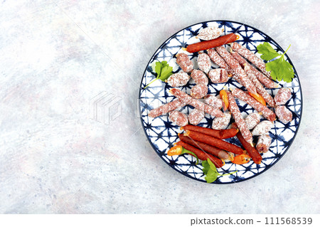 Tasty salami on a plate 111568539