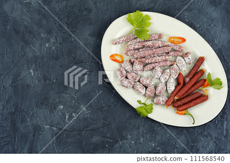 Salami on a plate, Italian salami. 111568540
