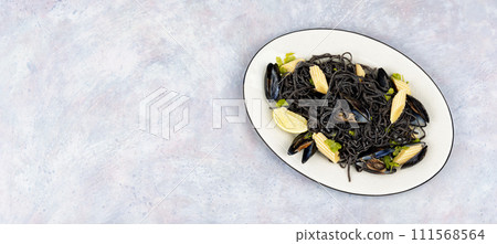 Black spaghetti pasta with mussels. 111568564