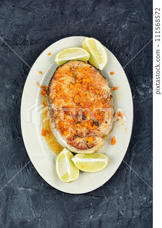 Grilled, baked, roasted fish salmon. 111568572