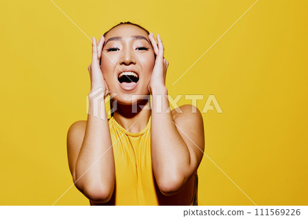 Yellow woman beauty swimsuit summer smile casual trendy fashion surprised emotion portrait Yellow woman beauty swimsuit summer smile casual trendy fashion surprised emotion portrait 111569226