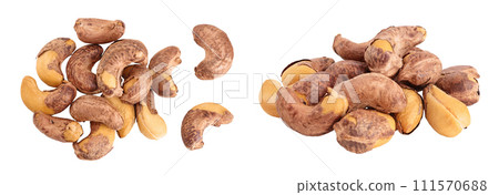 cashew nuts heap with shell isolated on white background. Top view. Flat lay cashew nuts heap with shell isolated on white background. Top view. Flat lay 111570688