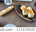 Butter and bread for course meal 111572035