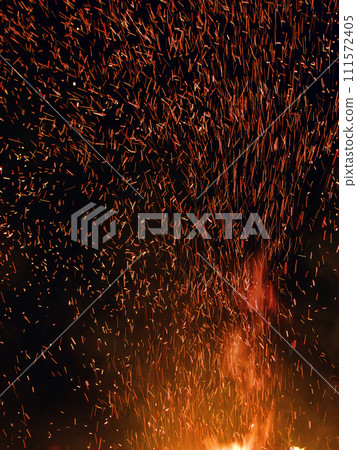 Whole swarm of sparks from nightly fire 111572405