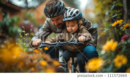 AI-generated content. In the family garden, a father teaches his son to ride while wearing a helmet for safety while riding a bicycle. An active father guiding and supporting his child while cycling. 111572669