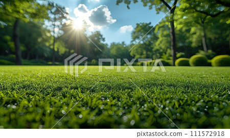 AI-generated content. In this blurry background image of spring nature, a neatly trimmed lawn is surrounded by trees against a blue sky with clouds. 111572918