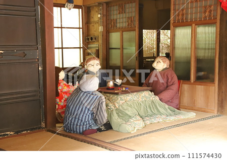 A family relaxing with a kotatsu A family relaxing with a kotatsu 111574430