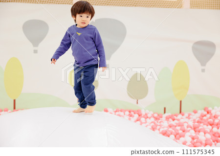 A boy playing around cheerfully 111575345