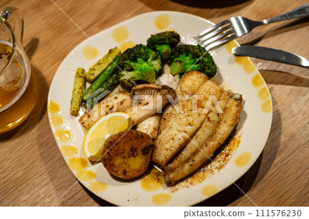 Flounder meuniere and grilled vegetables Flounder meuniere and grilled vegetables 111576230