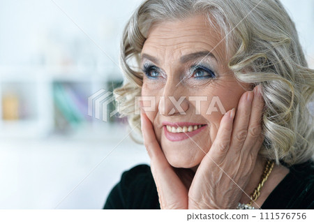 Beautiful happy senior woman posing at home 111576756