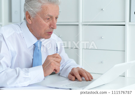 Close up portrait of thoughtful senior businessman Close up portrait of thoughtful senior businessman 111576787
