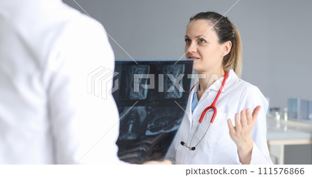 Doctors discussing patient diagnosis based x-ray 111576866