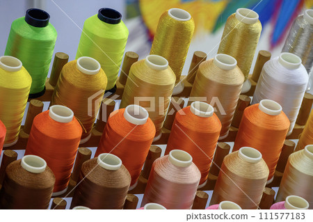 Close up the multi-color the group of industry bobbin thread. 111577183