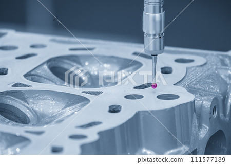 The multi axis CMM machine measuring the aluminum cylinder head parts . 111577189