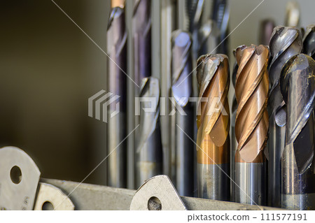 Close-up scene the group of used cutter end mill tools. Close-up scene the group of used cutter end mill tools. 111577191