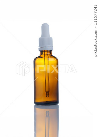 Closeup of glass bottle of cosmetic oil 111577243