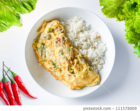 Omelet with pork and chili on rice on  the white background 111578009