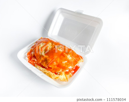 Omelet with pork and chili sauce on rice in the white food tray Omelet with pork and chili sauce on rice in the white food tray 111578034