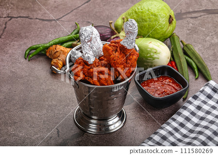 Indian cuisine glazed chicken lollipop Indian cuisine glazed chicken lollipop 111580269