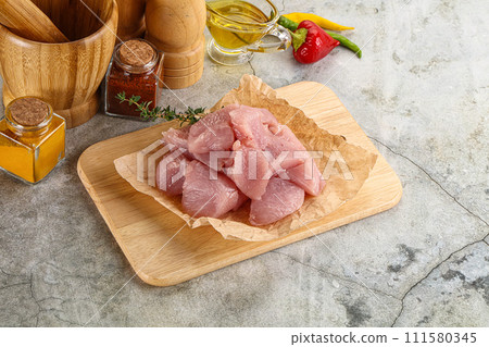 Raw turkey breat fillet cubes 111580345