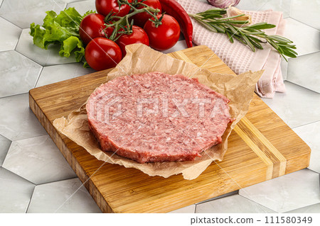 Raw beef uncooked burger cutlet Raw beef uncooked burger cutlet 111580349