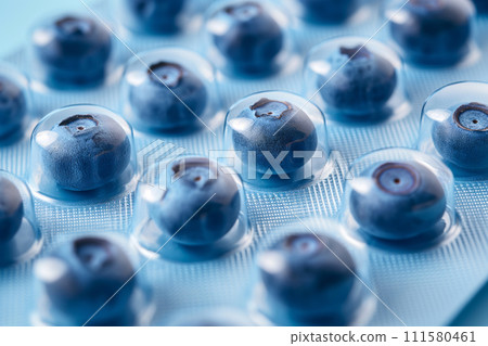 Blister with blueberries as pills. Berries instead of tablets. Natural Vitamin C supplement. Immune system boost. Tablets, pharmacy, medicine, vitamins. Health and medicine, sports nutrition concept 111580461