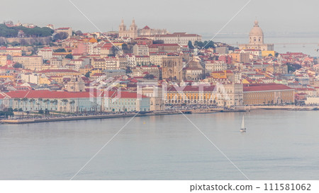 Aerial view of colorful orange roofs of the Alfama district and the Comercio Square timelapse of Lisbon, Portugal Aerial view of colorful orange roofs of the Alfama district and the Comercio Square timelapse of Lisbon, Portugal 111581062