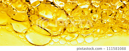 Transparent yellow bubbles in liquid. Cosmetic essence, serum. Oil in water, hydrophilic skin care. Banner, macro Scientific study using a microscope Transparent yellow bubbles in liquid. Cosmetic essence, serum. Oil in water, hydrophilic skin care. Banner, macro Scientific study using a microscope 111581088