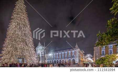 Panorama showing Commerce square illuminated and decorated at Christmas time in Lisbon night timelapse. Portugal Panorama showing Commerce square illuminated and decorated at Christmas time in Lisbon night timelapse. Portugal 111581094